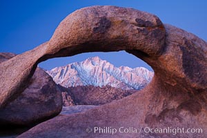 Mobius Arch at sunrise, framing snow dusted Lone Pine Peak and the Sierra Nevada Range in the background. Also known as Galen's Arch, Mobius Arch is found in the Alabama Hills Recreational Area near Lone Pine
