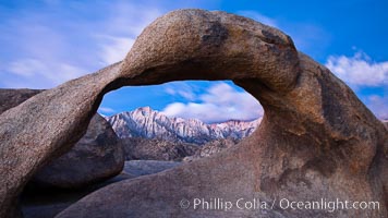 Mobius Arch at sunrise, framing snow dusted Lone Pine Peak and the Sierra Nevada Range in the background. Also known as Galen's Arch, Mobius Arch is found in the Alabama Hills Recreational Area near Lone Pine