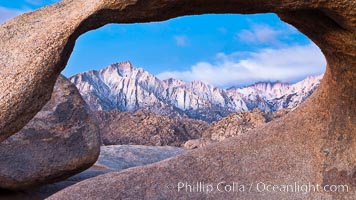 Mobius Arch at sunrise, framing snow dusted Lone Pine Peak and the Sierra Nevada Range in the background. Also known as Galen's Arch, Mobius Arch is found in the Alabama Hills Recreational Area near Lone Pine