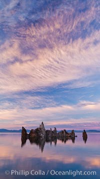 Mono Lake sunset, tufa and clouds reflected in the still waters of Mono Lake