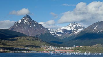 Mount Olivia (1318m) and the Five Brothers (Mount Cinco Hermanos, 1280m) in the Fuegian Andes rise above Ushuaia, the capital of the Tierra del Fuego region of Argentina.  The Beagle Channel fronts Ushuaia in the foreground