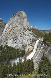 Nevada Falls, with Liberty Cap rising above it. Nevada Falls marks where the Merced River plummets almost 600 through a joint in the Little Yosemite Valley, shooting out from a sheer granite cliff and then down to a boulder pile far below, Yosemite National Park, California