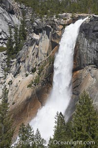 Nevada Falls marks where the Merced River plummets almost 600 through a joint in the Little Yosemite Valley, shooting out from a sheer granite cliff and then down to a boulder pile far below, Yosemite National Park, California