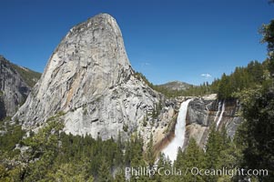 Nevada Falls, with Liberty Cap rising above it. Nevada Falls marks where the Merced River plummets almost 600 through a joint in the Little Yosemite Valley, shooting out from a sheer granite cliff and then down to a boulder pile far below, Yosemite National Park, California