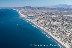 Coastal Oceanside, including Oceanside Pier and Oceanside Harbor, view toward the north showing Camp Pendleton in the distance, aerial photo
