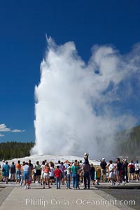 A crowd enjoys watching Old Faithful geyser at peak eruption, Upper Geyser Basin, Yellowstone National Park, Wyoming