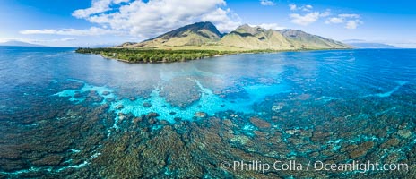 Olowalu coral reef and coast with West Maui mountains, aerial panoramic photo