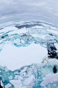 Pack ice and brash ice fills the Weddell Sea, near the Antarctic Peninsula.  This pack ice is a combination of broken pieces of icebergs, sea ice that has formed on the ocean