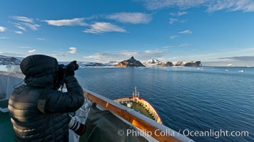 Photographer making pictures as M/V Polar Star approaches Devil Island
