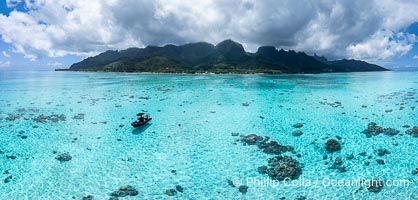 Reef flat and lagoon, aerial view, Moorea, French Polynesia. Nu'urua and Iumaru communities along the coast