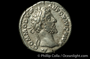 Roman emperor Commodus (177-192 A.D.), depicted on ancient Roman coin (silver, denom/type: Denarius) (AR , Denarius Obverse: M.COMMODVS.ANTON.AVG.PIVS. Reverse: PM.TR.P.VIIII.IMP.VI.COS.IIII.PP. Providentia standing left holding scepter and using baton to point to globe.)