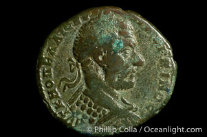 Roman emperor Macrinus (217-218 A.D.), depicted on ancient Roman coin (bronze, denom/type: AE27) (AE 27 of Nicopolis in Moesia, under Legate Statius Longinus; F+. Obverse: Laureated, draped, cuirassed bust right. Reverse: Apollo standing left, holds branch.)