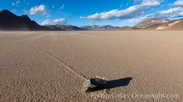 Sailing stone on the Racetrack Playa. The sliding rocks, or sailing stones, move across the mud flats of the Racetrack Playa, leaving trails behind in the mud. The explanation for their movement is not known with certainty, but many believe wind pushes the rocks over wet and perhaps icy mud in winter, Death Valley National Park, California