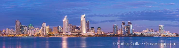 Full moon rising over San Diego city skyline, sunset, storm clouds, viewed from Coronado Island