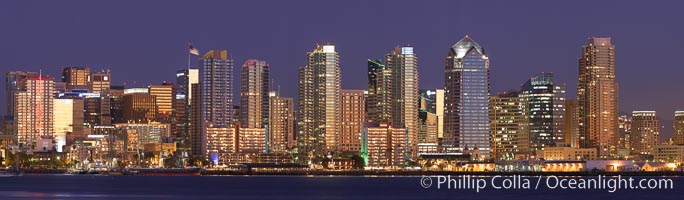 San Diego city skyline at sunset, showing the buildings of downtown San Diego rising above San Diego Harbor, viewed from Harbor Island.  A panoramic photograph, composite of thirteen separate images