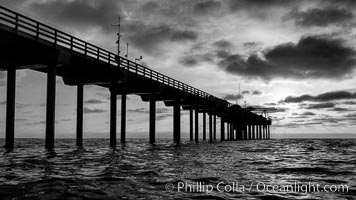 Scripps Pier, Surfer's view from among the waves. Research pier at Scripps Institution of Oceanography SIO, sunset, La Jolla, California