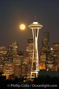 Full moon rises over Seattle city skyline, Space Needle at right