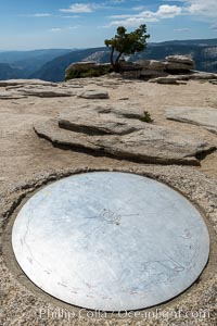 Sentinel Dome summit compass marker, showing notable peaks ion the horizon in all directions, Yosemite National Park