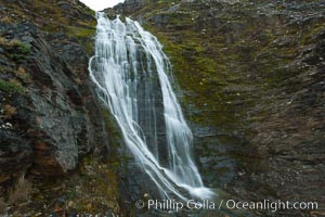 Shackleton Falls, named for explorer Sir Ernest Shackleton, formed from glacial meltwaters, near Stromness Bay, Stromness Harbour