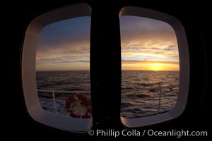 Sunset viewed through the window of my cabin on the M/V Polar Star, somewhere between Falkland Islands and South Georgia Island