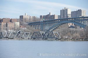 Spuyten Duyvil Swing Bridge (foreground) and Henry Hudson Bridge (background).  The Spuyten Duyvil Bridge is a swing bridge that carries Amtrak's Empire Corridor line across the Spuyten Duyvil Creek between Manhattan and the Bronx, in New York City. The bridge is located at the point where Spuyten Duyvil Creek and the Hudson River meet