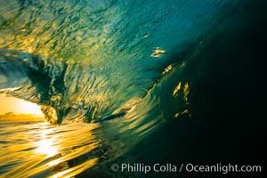 Sunrise breaking wave at the Wedge, dawn surf, The Wedge, Newport Beach, California