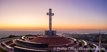 Sunrise over The Mount Soledad Cross, a landmark in La Jolla, California. The Mount Soledad Cross is a 29-foot-tall cross erected in 1954. Aerial photo