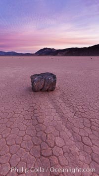 Sunrise on the Racetrack Playa. The sliding rocks, or sailing stones, move across the mud flats of the Racetrack Playa, leaving trails behind in the mud. The explanation for their movement is not known with certainty, but many believe wind pushes the rocks over wet and perhaps icy mud in winter, Death Valley National Park, California