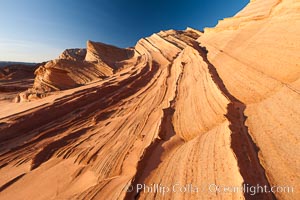 Sandstone "fins", eroded striations that depict how sandstone -- ancient compressed sand -- was laid down in layers over time.  Now exposed, the layer erode at different rates, forming delicate "fins" that stretch for long distances, Navajo Tribal Lands, Page, Arizona