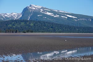 Tide flats exposed at low tide, with Chigmit Range in the background, Lake Clark National Park, Alaska