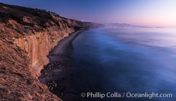 Seacliffs, La Jolla and evening lights, dusk, Pacific Ocean surf