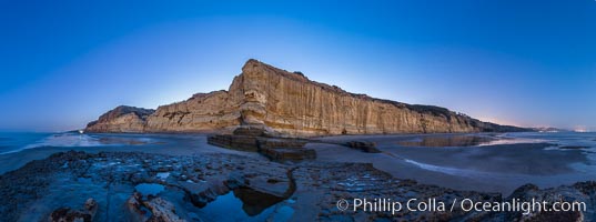 Torrey Pines Cliffs lit at night by a full moon, low tide reflections, Torrey Pines State Reserve, San Diego, California