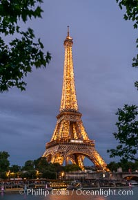 La Tour Eiffel. The Eiffel Tower is an iron lattice tower located on the Champ de Mars in Paris, named after the engineer Gustave Eiffel, who designed the tower in 1889 as the entrance arch to the 1889 World's Fair. The Eiffel tower is the tallest structure in Paris and the most-visited paid monument in the world