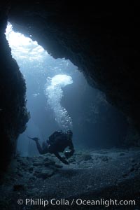 A SCUBA diver enters a submarine cavern at Santa Barbara Island, underwater cave
