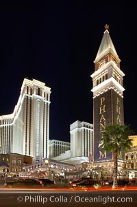 The Venetian Hotel rises above the Strip, Las Vegas Boulevard, at night