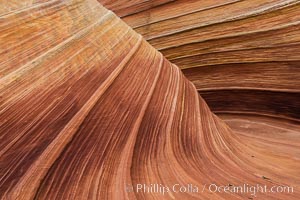 The Wave in the North Coyote Buttes, an area of fantastic eroded sandstone featuring beautiful swirls, wild colors, countless striations, and bizarre shapes set amidst the dramatic surrounding North Coyote Buttes of Arizona and Utah. The sandstone formations of the North Coyote Buttes, including the Wave, date from the Jurassic period. Managed by the Bureau of Land Management, the Wave is located in the Paria Canyon-Vermilion Cliffs Wilderness and is accessible on foot by permit only