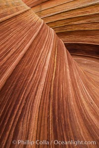 The Wave in the North Coyote Buttes, an area of fantastic eroded sandstone featuring beautiful swirls, wild colors, countless striations, and bizarre shapes set amidst the dramatic surrounding North Coyote Buttes of Arizona and Utah. The sandstone formations of the North Coyote Buttes, including the Wave, date from the Jurassic period. Managed by the Bureau of Land Management, the Wave is located in the Paria Canyon-Vermilion Cliffs Wilderness and is accessible on foot by permit only