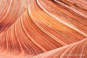 The Wave, an area of fantastic eroded sandstone featuring beautiful swirls, wild colors, countless striations, and bizarre shapes set amidst the dramatic surrounding North Coyote Buttes of Arizona and Utah.  The sandstone formations of the North Coyote Buttes, including the Wave, date from the Jurassic period. Managed by the Bureau of Land Management, the Wave is located in the Paria Canyon-Vermilion Cliffs Wilderness and is accessible on foot by permit only