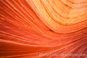 The Wave, an area of fantastic eroded sandstone featuring beautiful swirls, wild colors, countless striations, and bizarre shapes set amidst the dramatic surrounding North Coyote Buttes of Arizona and Utah.  The sandstone formations of the North Coyote Buttes, including the Wave, date from the Jurassic period. Managed by the Bureau of Land Management, the Wave is located in the Paria Canyon-Vermilion Cliffs Wilderness and is accessible on foot by permit only