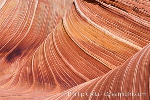 The Wave, an area of fantastic eroded sandstone featuring beautiful swirls, wild colors, countless striations, and bizarre shapes set amidst the dramatic surrounding North Coyote Buttes of Arizona and Utah.  The sandstone formations of the North Coyote Buttes, including the Wave, date from the Jurassic period. Managed by the Bureau of Land Management, the Wave is located in the Paria Canyon-Vermilion Cliffs Wilderness and is accessible on foot by permit only