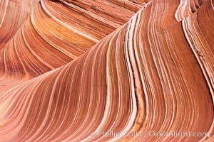 The Wave, an area of fantastic eroded sandstone featuring beautiful swirls, wild colors, countless striations, and bizarre shapes set amidst the dramatic surrounding North Coyote Buttes of Arizona and Utah.  The sandstone formations of the North Coyote Buttes, including the Wave, date from the Jurassic period. Managed by the Bureau of Land Management, the Wave is located in the Paria Canyon-Vermilion Cliffs Wilderness and is accessible on foot by permit only