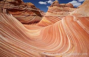 The Wave, an area of fantastic eroded sandstone featuring beautiful swirls, wild colors, countless striations, and bizarre shapes set amidst the dramatic surrounding North Coyote Buttes of Arizona and Utah.  The sandstone formations of the North Coyote Buttes, including the Wave, date from the Jurassic period. Managed by the Bureau of Land Management, the Wave is located in the Paria Canyon-Vermilion Cliffs Wilderness and is accessible on foot by permit only