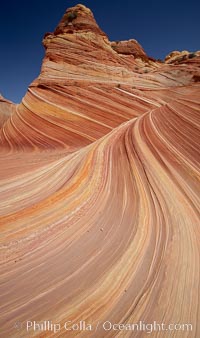 The Wave, an area of fantastic eroded sandstone featuring beautiful swirls, wild colors, countless striations, and bizarre shapes set amidst the dramatic surrounding North Coyote Buttes of Arizona and Utah.  The sandstone formations of the North Coyote Buttes, including the Wave, date from the Jurassic period. Managed by the Bureau of Land Management, the Wave is located in the Paria Canyon-Vermilion Cliffs Wilderness and is accessible on foot by permit only