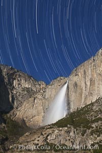 Yosemite Falls and star trails, at night, viewed from Cook's Meadow, illuminated by the light of the full moon, Yosemite National Park, California