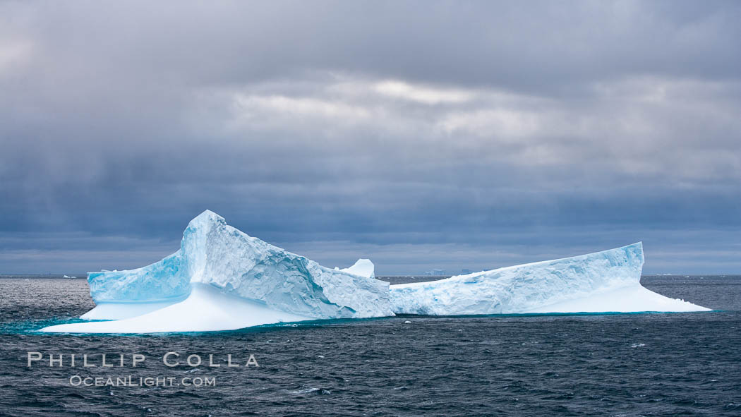 Iceberg, ocean, light and clouds.  Light plays over icebergs and the ocean near Coronation Island. South Orkney Islands, Southern Ocean, natural history stock photograph, photo id 24779