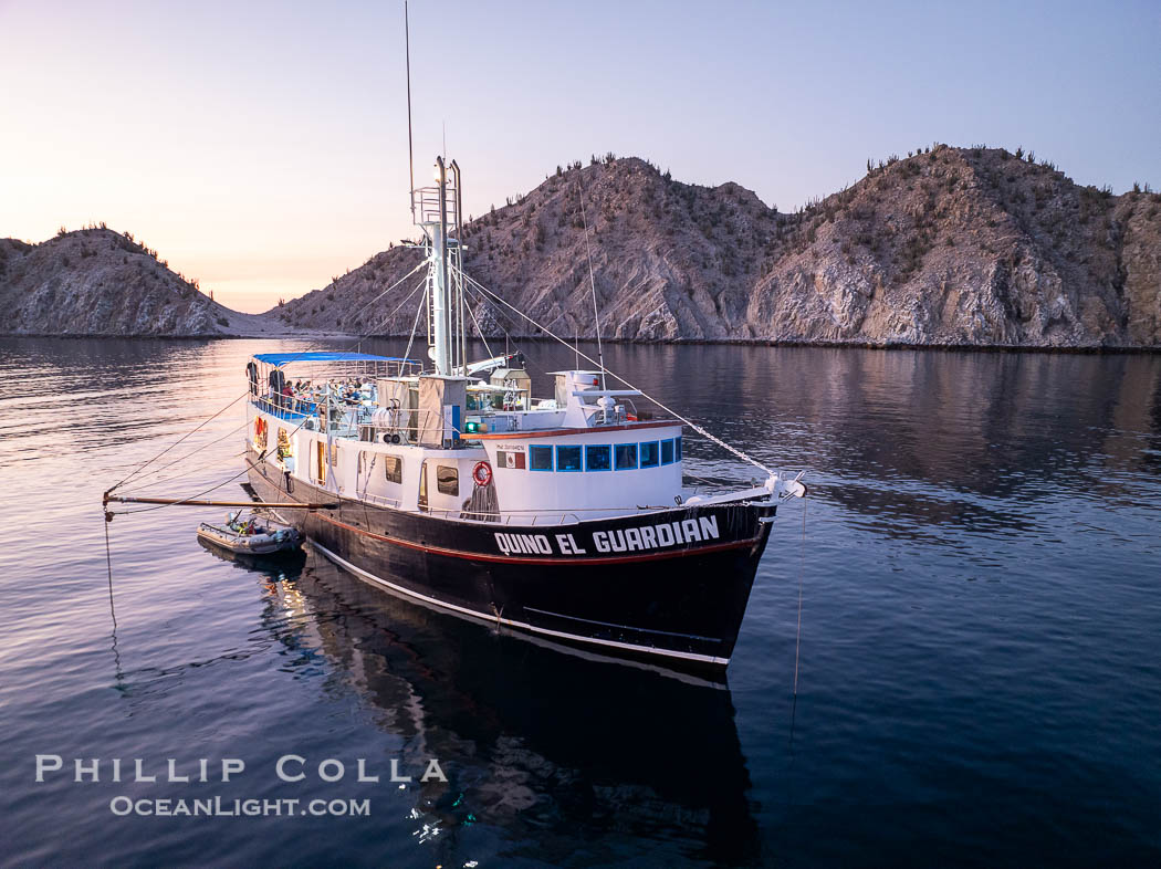 Dive boat Quino el Guardian anchored at  Isla Angel de la Guarda at Sunset, Aerial Photo, Sea of Cortez, Mexico.  Guardian Angel island is part of the Midriff Islands in Mexico's Sea of Cortez. Baja California, natural history stock photograph, photo id 40369