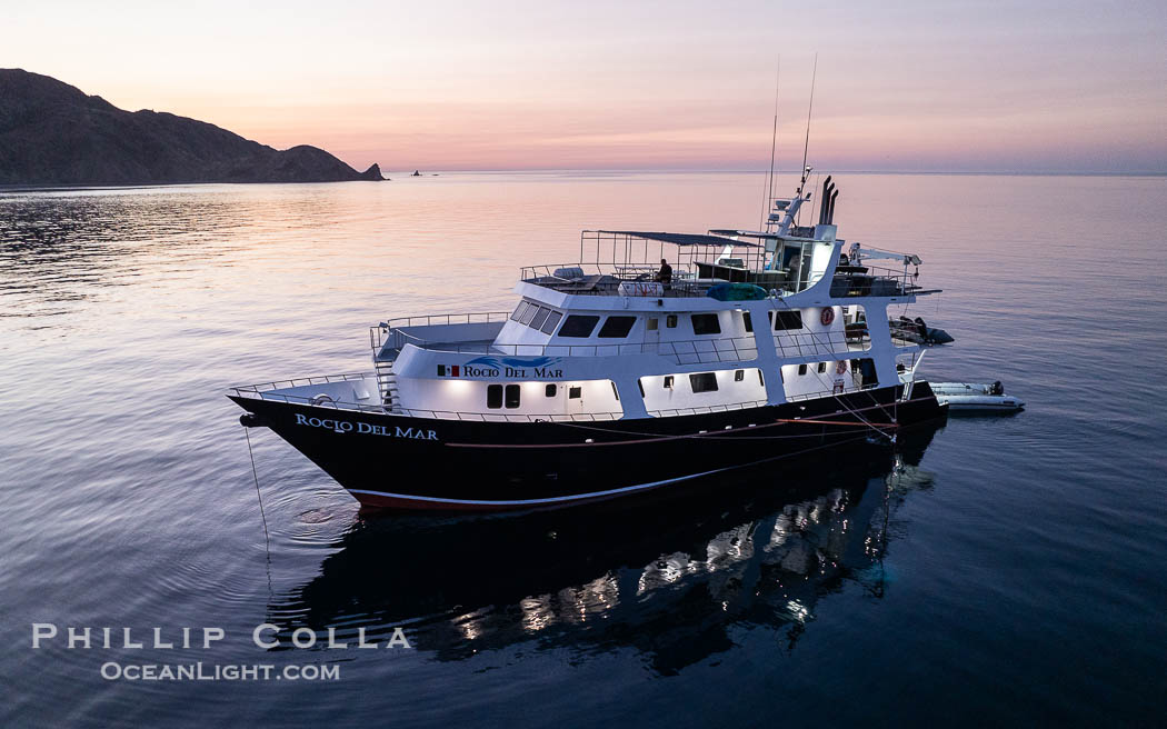 Dive boat Rocio del Mar anchored at  Isla Angel de la Guarda at Sunset, Aerial Photo, Sea of Cortez, Mexico.  Guardian Angel island is part of the Midriff Islands in Mexico's Sea of Cortez. Baja California, natural history stock photograph, photo id 40366