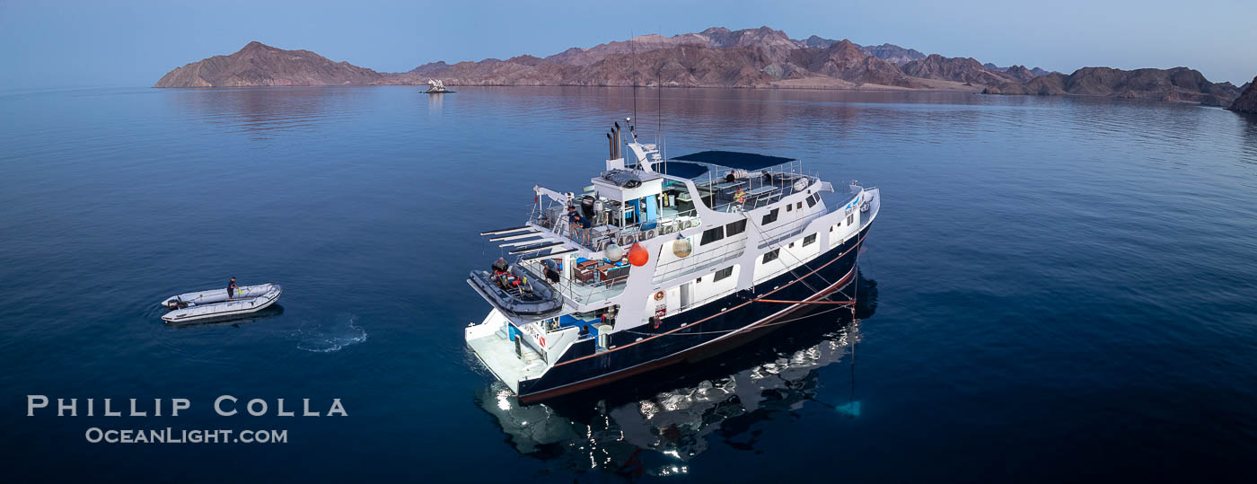 Dive boat Rocio del Mar anchored at  Isla Angel de la Guarda at Sunset, Aerial Photo, Sea of Cortez, Mexico.  Guardian Angel island is part of the Midriff Islands in Mexico's Sea of Cortez. Baja California, natural history stock photograph, photo id 40367