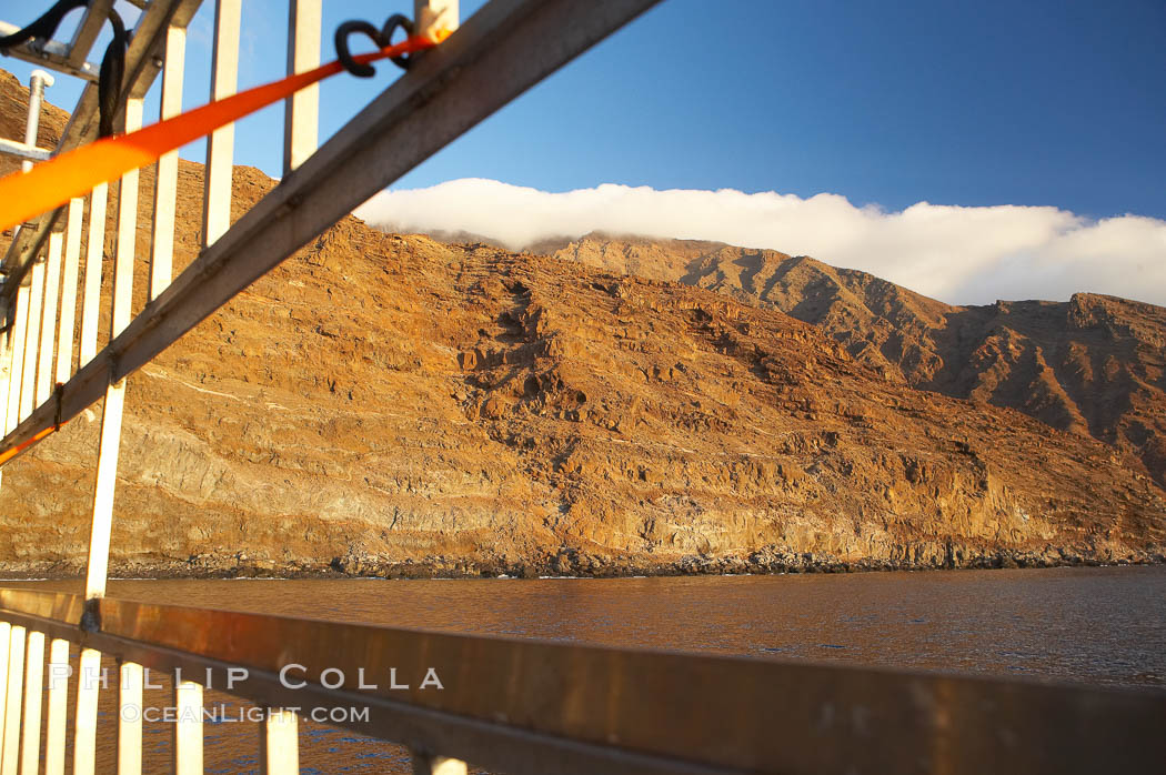 Guadalupe island at sunrise, viewed through the bars of an aluminum shark cage. Guadalupe Island (Isla Guadalupe), Baja California, Mexico, natural history stock photograph, photo id 19487