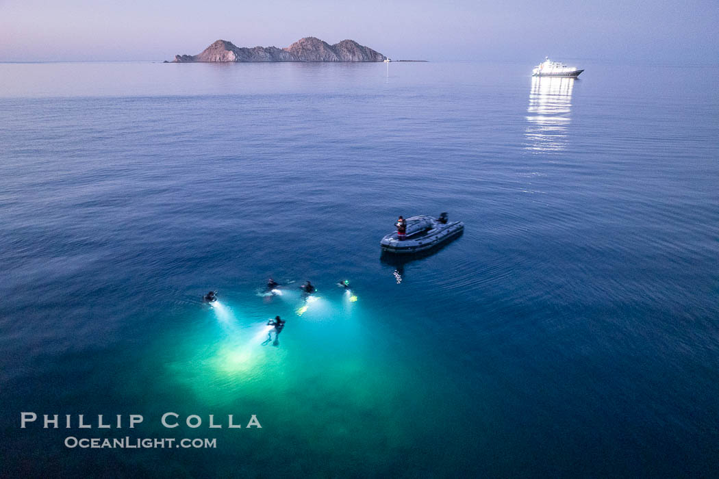 SCUBA Divers at Night, Isla de la Guarda Island, aerial photo, Sea of Cortez. Dive boat Rocio del Mar is seen in the distance. Night diving is scary so I stay on the big boat and fly my drone, Isla Angel de la Guarda, Baja California, Mexico